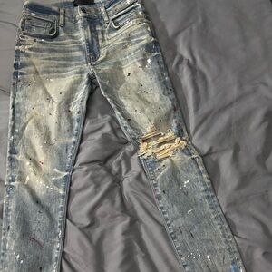 AMIRI Blue Skinny Jeans with Distressed Paint Design
